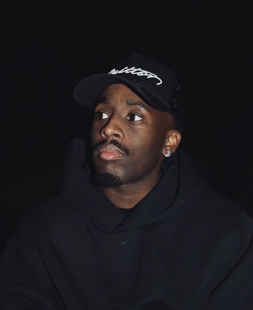 Portrait of a man in a black cap