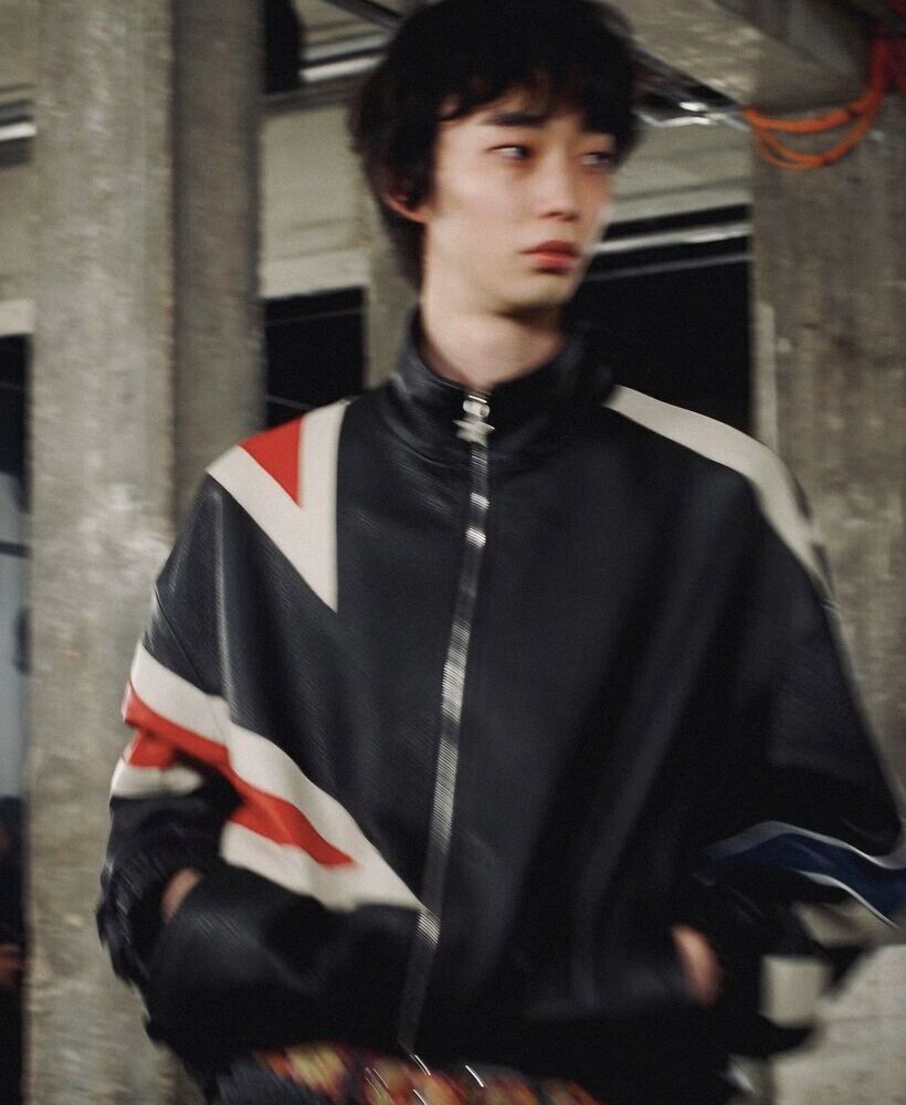 Young man in a striped track jacket