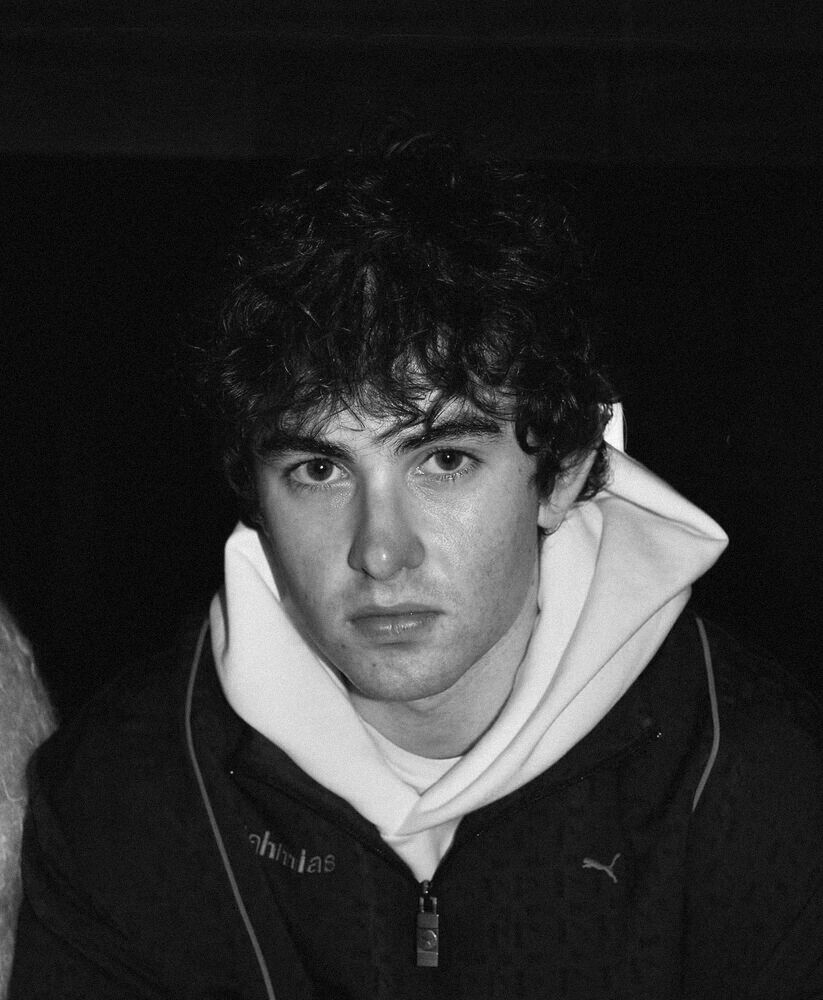 Black and white portrait in a white hoodie