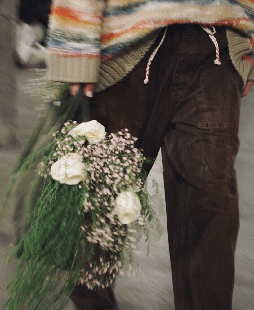 White flowers carried down a runway