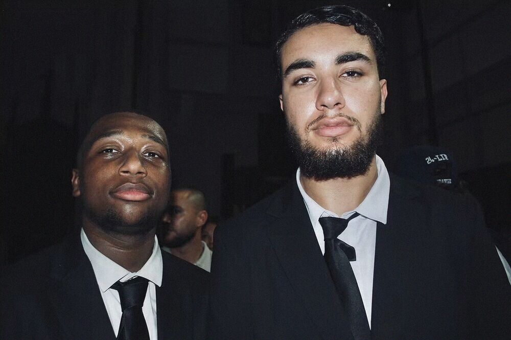 Two men in dark suits