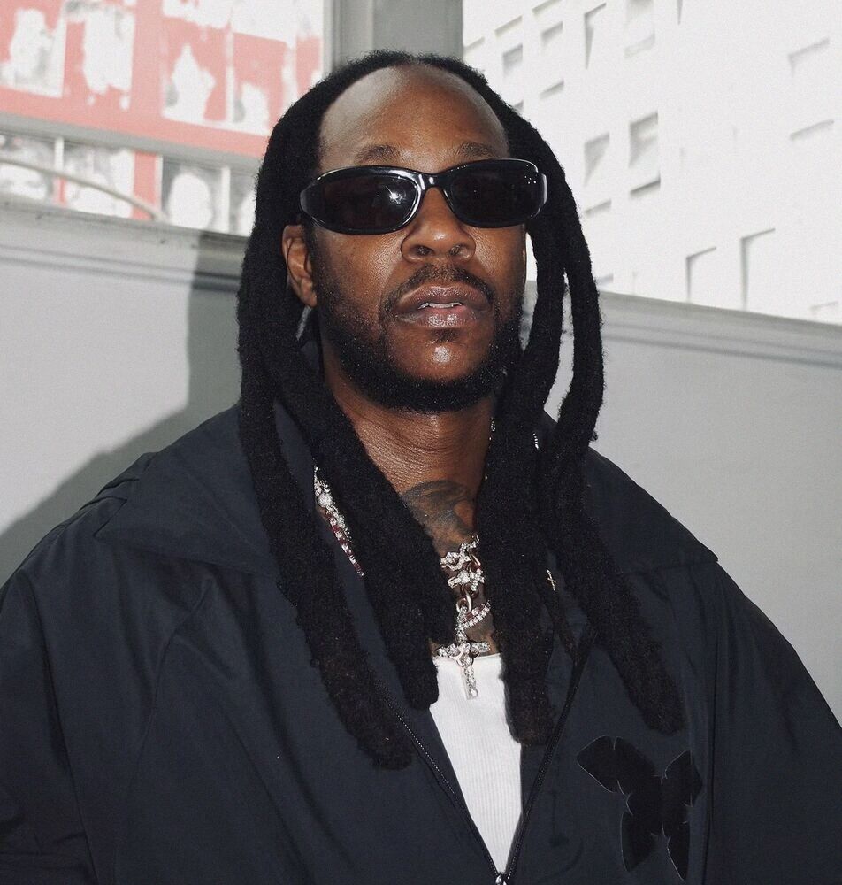 Man with long locs and sunglasses