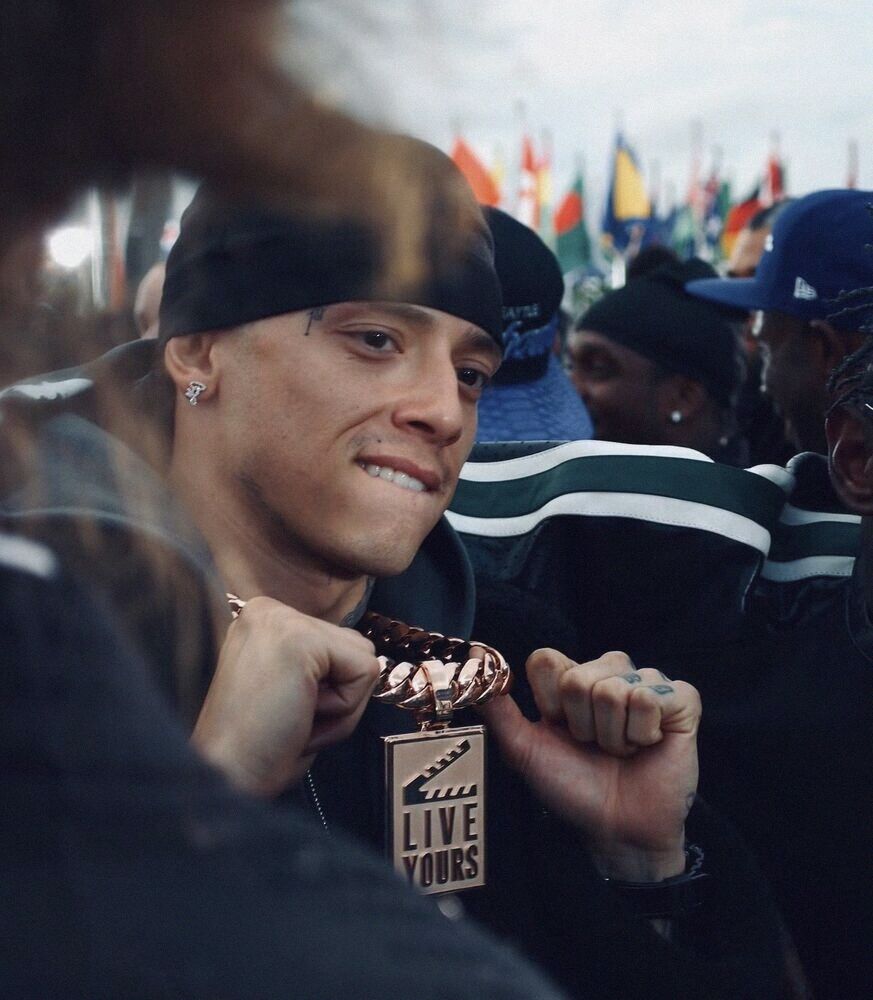 Young man in a headband among a crowd